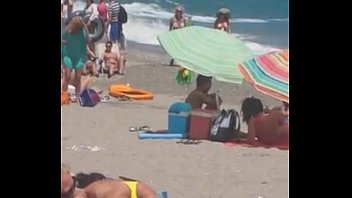 woman masturbating on the beach