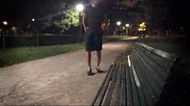 A young guy strips totally in a public park - (almost ?) caught by cyclist