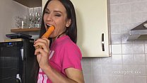 Russian pornstar Nataly Gold rubs her hole with carrot in the kitchen