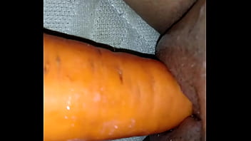 Naughty masturbating with carrot.
