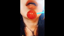 Iara sucking on a pink lollipop imagining that delicious roll