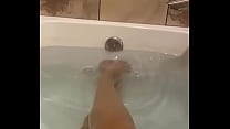 Playing with my feet in the tub, like my legs?