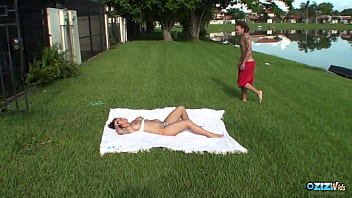When he notices a topless busty brunette sunbathing he gets his big cock out immediately
