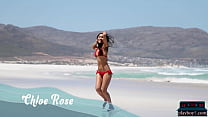 Petite Asian MILF model Chloe Rose gives a bikini striptease on the beach
